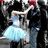 A pixelated image of a couple dancing, with the woman in a light blue dress and the man in dark clothing, next to cyan text reading 'dance to show your heart' on black background.