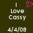 A dark green background displays white text reading "I Love Cassy" with a pink pixelated heart above the word "Love," and "4/4/08" below, in two identical side-by-side arrangements.