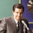 A split-frame contact sheet showing a pixelated image of a man speaking into a microphone on the left and green text reading "Original Icons .com" on the right against a dark background.
