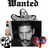 Pixelated image shows a black and white camera with silver accents, red heart-shaped object on right, small skull icon below left, and 'Wanted' text at top.