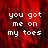 Red-toned pixelated background with white text reading "you got me on my toes" in four identical arranged in a