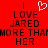 Red background with black pixelated text reading 'I LOVE JARED MORE THAN HER' and a white heart symbol above the word 'LOVE'.