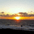 A four- with a sunset beach scene and red text on yellow backgrounds, labeled 'california' and 'here i come' in pixelated font
