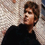A 50x50 pixel animated contact sheet showing two frames of a person in black clothing against a gradient background with visible dithering and pixelation.