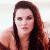 A pixelated image of a person with long brown hair against a light background, next to green text reading 'Original Icons .com' on dark green.