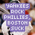 Pixelated image with purple text overlay reading 'YANKEES ROCK PHILLIES, BOSTON SUCK' on a blurred background.