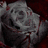 Four distinct animated scenes: a gray rose with red accents, a figure in dark clothing and horns, a skeletal hand holding a pink object, and an empty light gray space.
