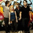 Pixelated group of people in dark clothing with orange text 'paramore' on white background.