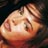 Pixelated close-up of a cartoon-style face with light skin tones and brown hair against a dark background, rendered in low-resolution 256x256 pixels.