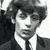 Black-and-white collage of six distinct headshots showing a person with dark hair in various poses and expressions, some cropped to show only the upper body.