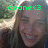 Pixelated image of a person with long hair holding an object, overlaid with green text reading 'done<3' against a blurred background.