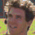 Two side-by-side pixelated images of a person with curly brown hair, one smiling and the other in profile view, below which is text reading "The Hair Defines The Man".