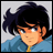Pixelated anime-style character with dark blue hair and light skin wearing a blue jacket over yellow clothing, next to text reading "Anime IM" and "com" on black background.