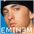 Pixelated static image of a person's face with blue background and distorted text at bottom.