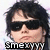 Pixelated image of a person with dark hair and sunglasses, wearing a checkered shirt, with text at the bottom.