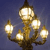 A pixelated streetlamp with six glowing light fixtures on a dark blue background, rendered in a low-resolution style.
