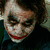 A four- shows a character with smeared white face paint, dark eye makeup, and red lips in various poses. Red text appears in two