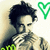 A person with dark curly hair holds a hand near their mouth, positioned next to green heart symbols and partial green text on a light background.