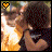 Two side-by-side pixelated images of a person with dark hair and sunglasses, one showing an orange heart icon in the top-left corner and the other showing a black heart icon.