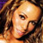 Pixelated close-up of a person's face with brown hair and warm skin tones, rendered in low-resolution 256x256 pixels.