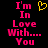 Pixelated text reads "I'm In Love With... You" in pink with a yellow heart symbol above the text on a black background.