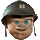 Pixelated cartoon head wearing dark helmet with light square emblem, blue eyes, brown hair, and earpieces; left side shows closed eye while right side shows open eye.
