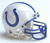 Pixelated image of a white football helmet with blue accents and a large blue horseshoe logo on the side, viewed from an angle against a light background.