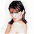 Pixelated image of a woman with dark brown hair styled in pigtails, wearing light-colored clothing against a white background.