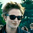 A pixelated image of a person with light brown hair and dark sunglasses, split into two vertical sections showing slight differences in expression.