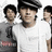 A pixelated image shows three people in a group, with a red background displaying red text reading "I love the jonas brothers".