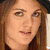 Two women appear in a split- layout; one wears a black hat and has hand near face, the other has long brown hair. Below them is rainbow-colored background with text