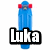 Blue skateboard with red wheels and gray trucks, overlaid with pixelated text reading 'Luka rocks big time!!' in black and white.