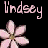 Pixelated pink flowers with a name above on black background, part of an animated contact sheet frame.