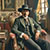 A pixelated static image shows a figure in dark clothing and hat holding two objects, with indistinct background elements.
