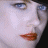 A 48x48 pixel buddy icon featuring a split composition with a close-up of a person's face on the left and "MOULIN ROUGE!" text on the right, rendered in low-resolution pixel art style.