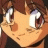 Pixelated anime-style character face with brown hair and large eyes, next to black background with white text.