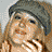 A 4-frame contact sheet of a pixelated animated icon featuring a woman with blonde hair wearing different hats across frames, with "Coolbuddy.com" text on the bottom-right frame.