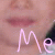 A close-up of a person's mouth with the word 'Me' written below in stylized text, shown in two color variations.