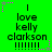 Green background with repeated text "I love kelly clarkson" and exclamation marks, surrounded by pink star-like shapes.