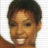 Static 48x48 pixel icon showing a close-up of a person's face with short dark hair, visible teeth in a smile, and light brown skin tone against a white background.