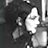 Static grayscale icon with high pixelation showing abstract shapes and a bright white area against dark background, likely depicting an indistinct figure or object in low-resolution form.