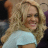 Static 48x48 pixel icon showing a person with long blonde hair wearing a light blue top, cropped to show upper body and face against dark background.