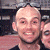 A 50x50 pixel animated contact sheet showing two frames of a buddy icon with a person's face on the left and green text "Original Icons .com" on a dark background on the right.
