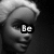 Black-and-white animated sequence of a doll's face with changing text overlays and head positions.
