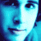 A blue-toned pixelated image with text overlays and a partial portrait of a person with light hair