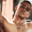 A 48x48 pixel animated contact sheet showing two frames of a shirtless person with short dark hair against a green background featuring "OriginalIcons.com" text in bright green pixelated font.