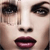 Pixelated close-up of a face showing eyes, nose, and lips with dark eyeliner and purple lipstick against a light skin tone background.