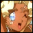 Pixelated anime-style character with light brown hair, blue eyes, and open mouth, next to black background with white text.