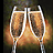 Two champagne flutes filled with golden liquid, positioned side-by-side against a dark background with warm orange and brown tones.