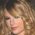 A pixelated image of a person with light brown curly hair, showing two distinct facial expressions in a split view.